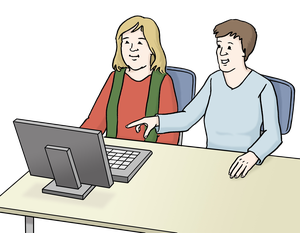 Zwei Frauen sitzen an einem Computer